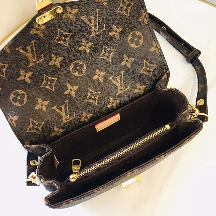 Louis Vuitton Crossbody Bag with a Side Slot for Storing Cards.