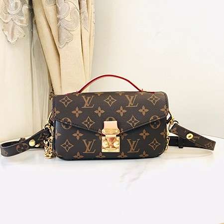 Louis Vuitton Crossbody Bag with a Side Slot for Storing Cards.
