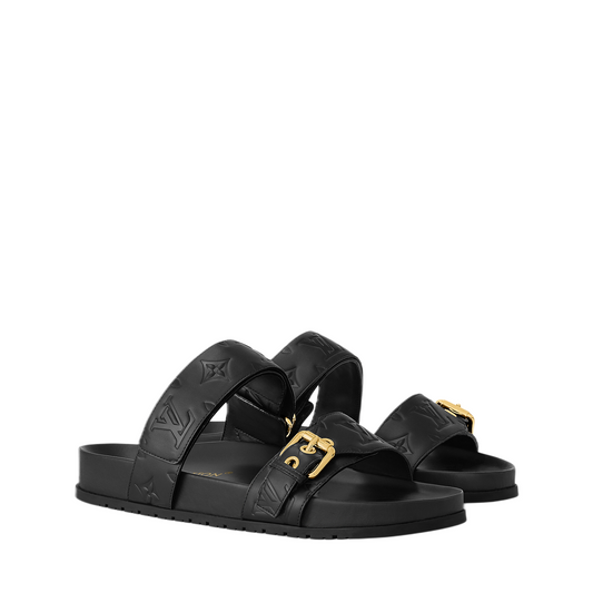 Louis Vuitton Bom Dia Flat Comfort Mule with embossed LV monogram pattern and anatomical black footbed