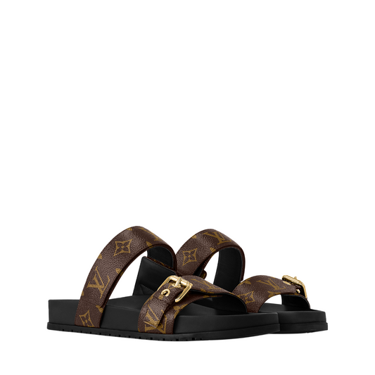 Luxury brown leather Louis Vuitton Bom Dia mules with comfortable micro-rubber outsoles.